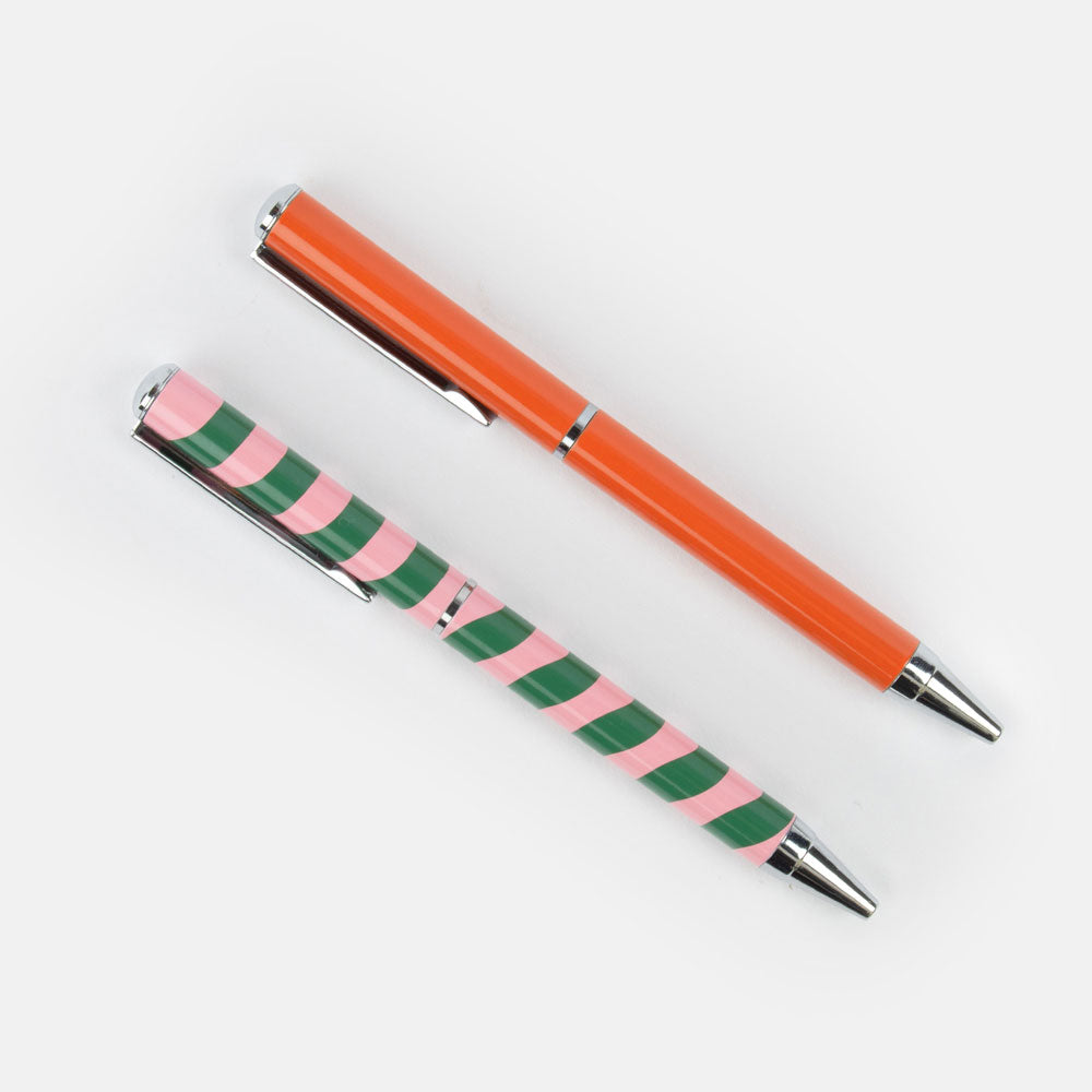 set of 2 ballpoint pens in a gift box. one orange and pink, one pink and green wave stripe design