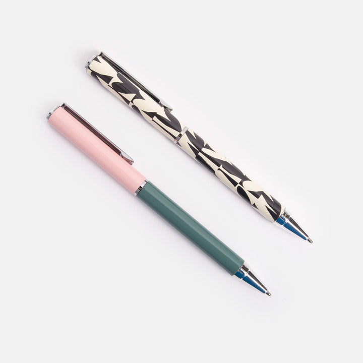 set of 2 boxed ballpoint pens, one in block green & pink the other in monochrome hearts print