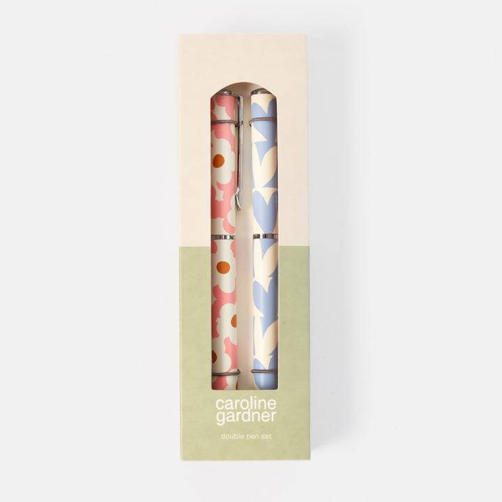 Caroline Gardner double pen set in a cream and sage green gift box, featuring two patterned pens with pink, blue, and cream floral designs.