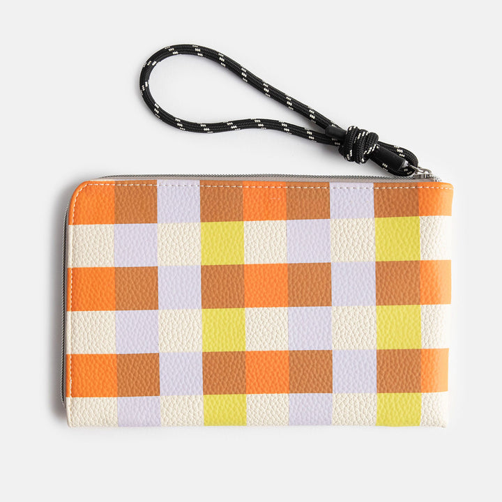 leather look PU travel pouch with internal pockets, with warm tones check design and a monochrome cord wrist strap