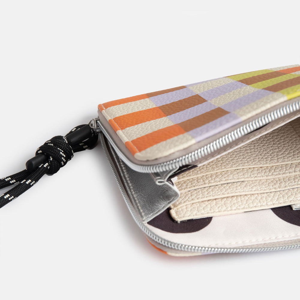 leather look PU travel pouch with internal pockets, with warm tones check design and a monochrome cord wrist strap