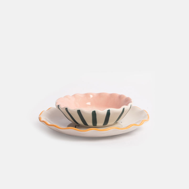 set of 2 ceramic trinket dishes featuring one small bowl with blue stripe outer and pink inner, and a larger flat dish with orange trim