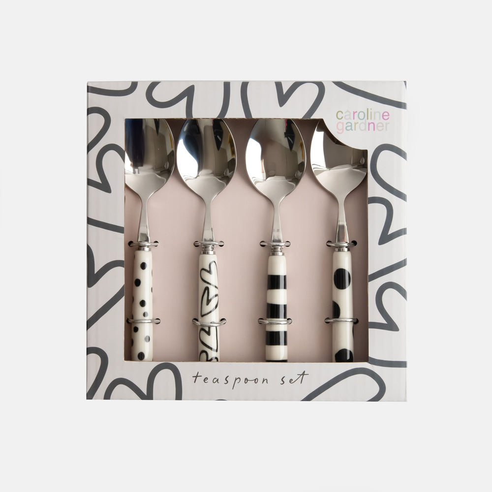 set of 4 hand painted stoneware & stainless steel teaspoons, each with different designs, in a presentation box