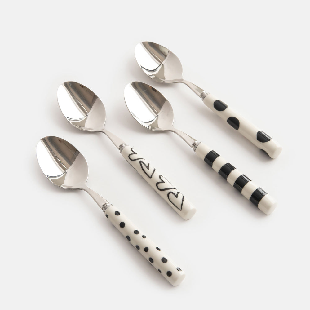 set of 4 hand painted stoneware & stainless steel teaspoons in white with black spots, stripes, dots and hearts designs. 