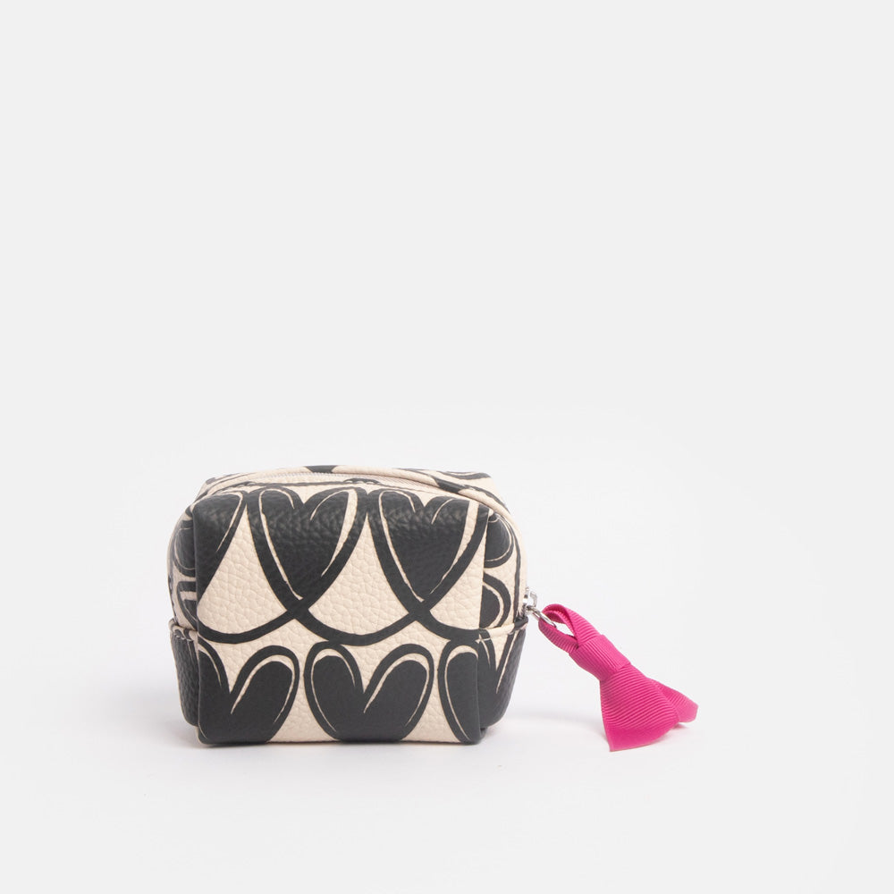 Cosmetic bag with black looped hearts pattern and pink ribbon on a white background