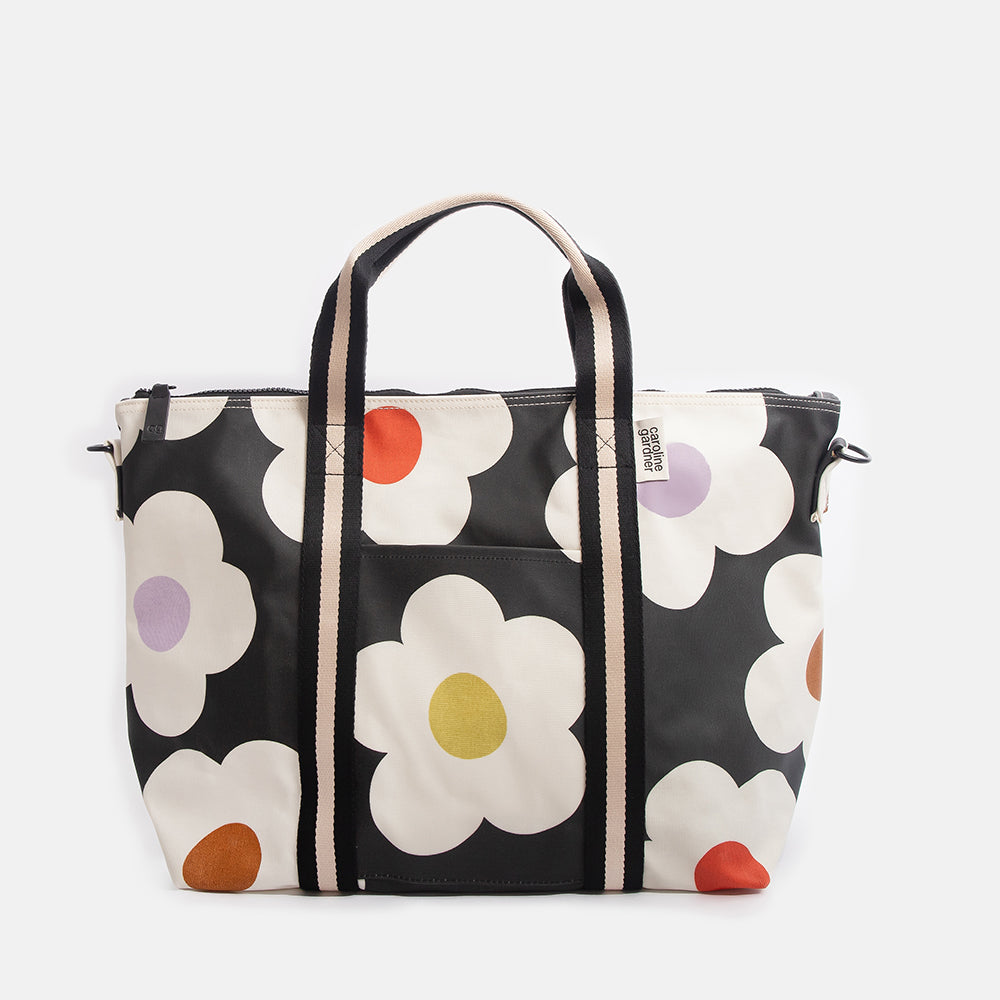 Floral-patterned weekend bag on a white background
