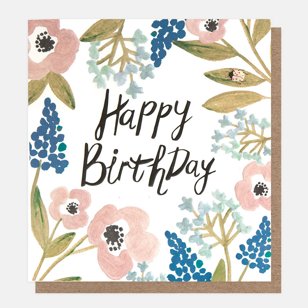 birthday card featuring a beetle amidst blue and pink flowers and 'happy birthday' message in black handwritten style lettering

