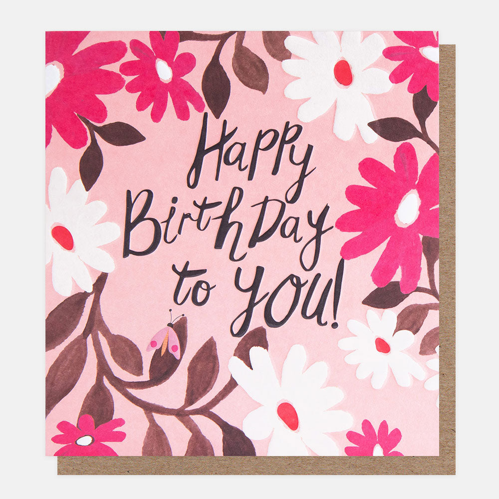 birthday card featuring a bug amidst pink and white flowers and 'happy birthday to you' message in black handwritten style lettering
