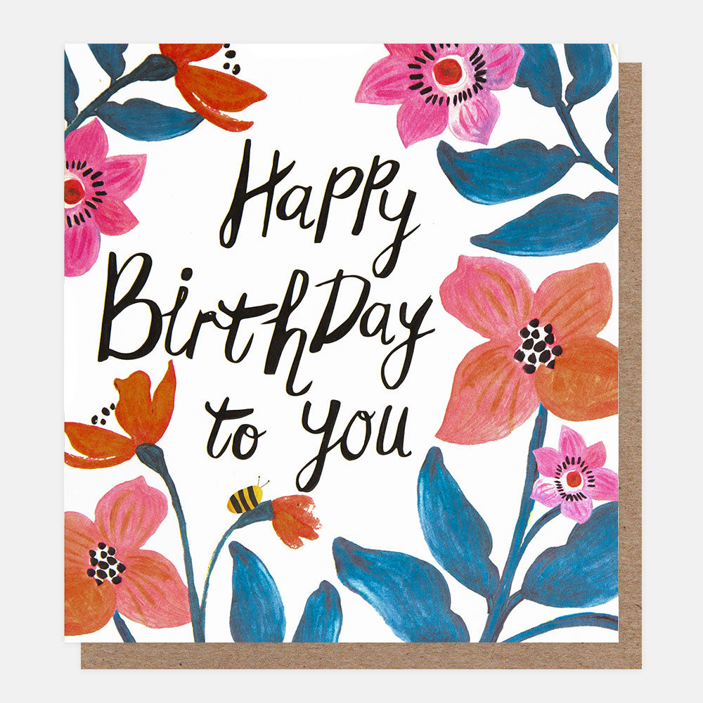 birthday card featuring a bee amidst blue, orange and pink flowers and 'happy birthday to you' message in black handwritten style lettering