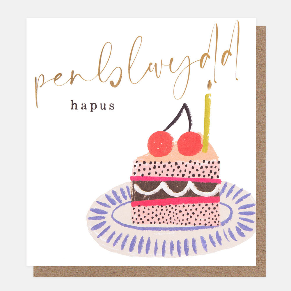 welsh language birthday card featuring a colourful slice of cake with cherries and a gold candle on top and the text penblwydd hapus