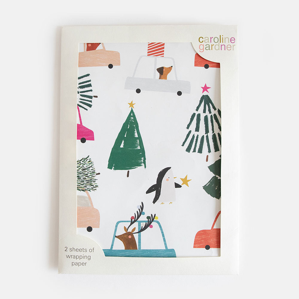 pack of 2 sheets of Christmas wrapping paper featuring a design of animals in cards and Christmas trees