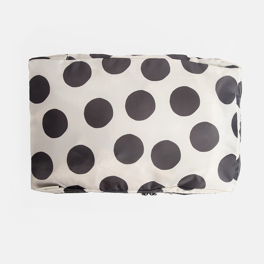 black & white polka dot packing cube on a white background