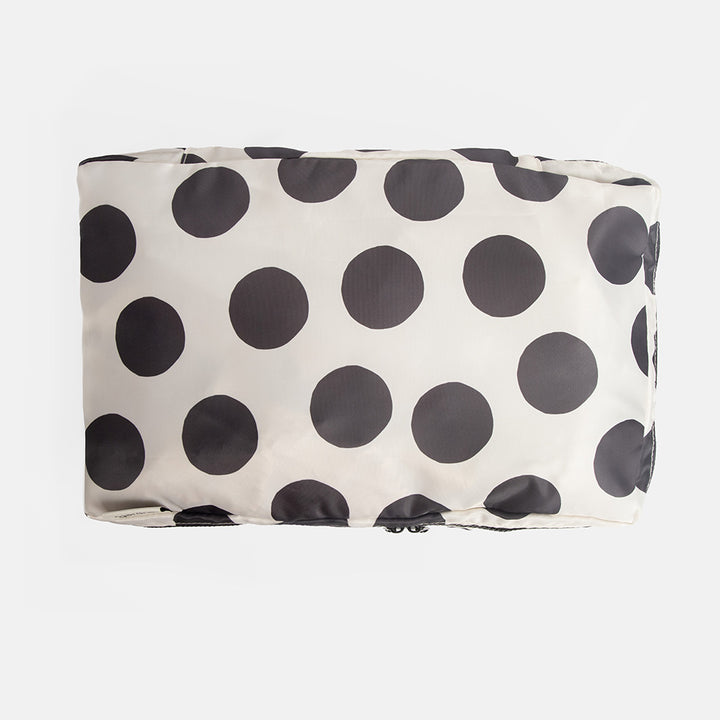 black & white polka dot packing cube on a white background