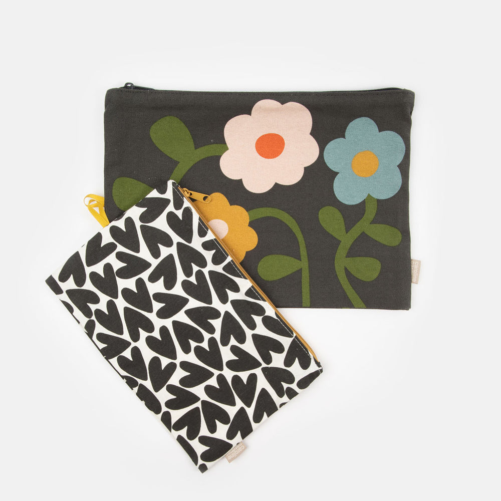 set of 2 cotton canvas travel pouches in floral and monochrome hearts designs