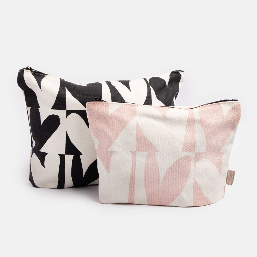 set of 2 cotton travel pouch bags with gusset, one large in monochrome hearts print, one small in pink hearts print