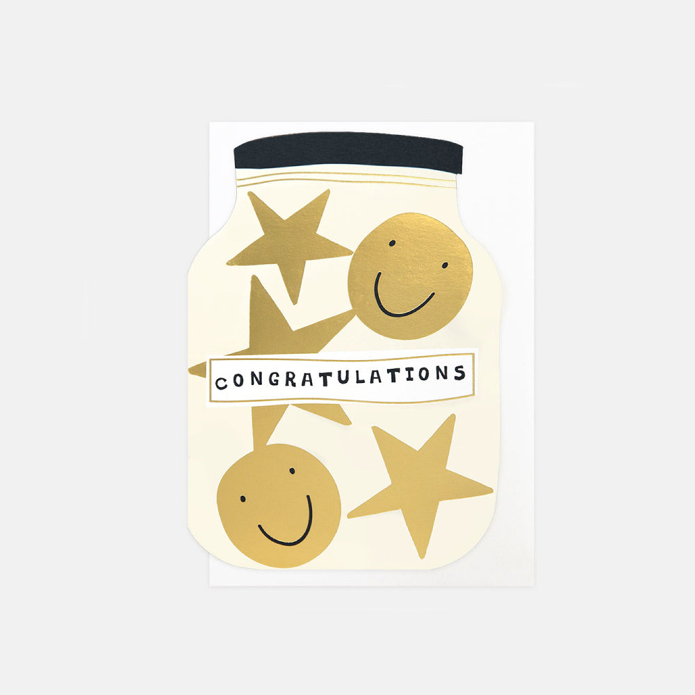 A congratulations greeting card featuring a stylized glass jar illustration with gold stars, smiling faces, and the word 'CONGRATULATIONS' on a white card against a light gray background.