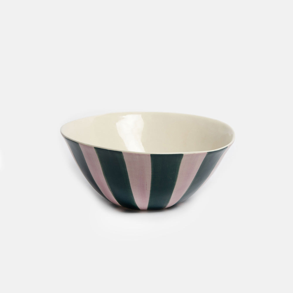 A ceramic bowl with a cream-colored interior and a patterned exterior featuring alternating vertical stripes of dark green and dusty pink, set against a plain light gray background.