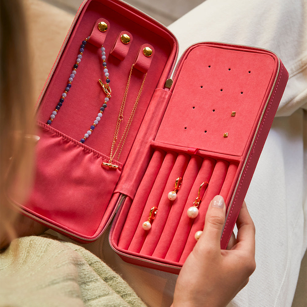 pink jewellery box internal with storage compartments for necklaces, earrings, rings and studs