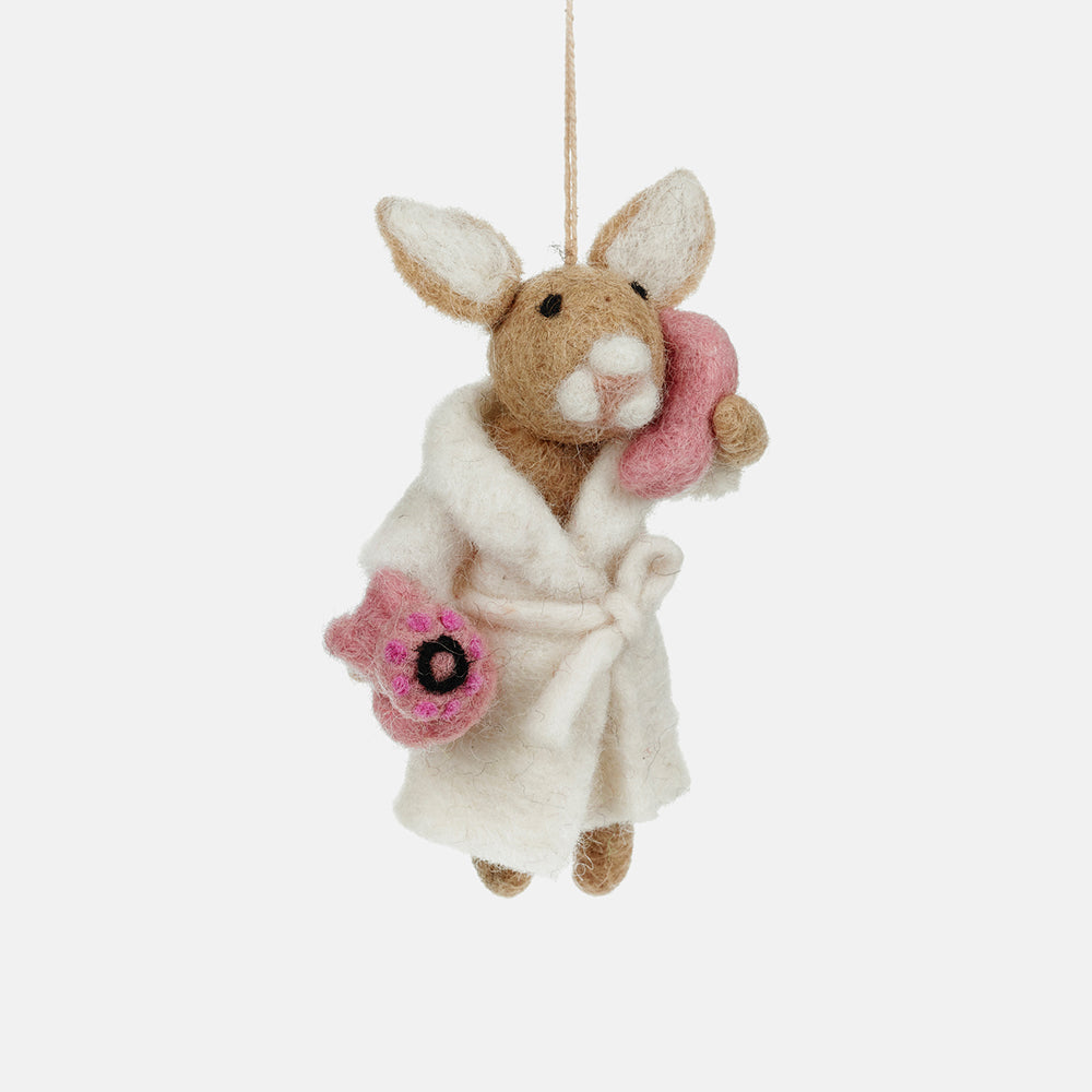 wool felt bunny christmas tree decoration on the phone in a dressing gown