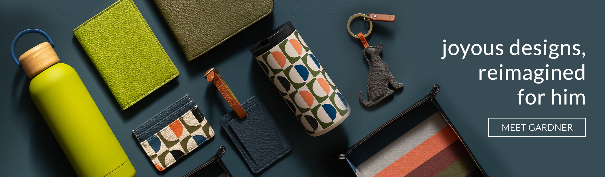 caroline gardner mens range featuring water bottle, passport cover, travel wallet, cardholder, dog keyring lugage tag, travel mug, coin tray