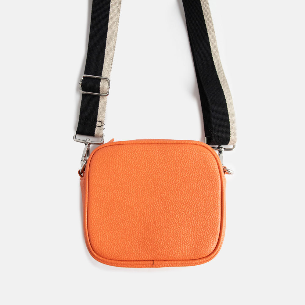 vegan leather orange camera bag with silver zip and hardware, monochrome webbing adjustable straps and spot print lining