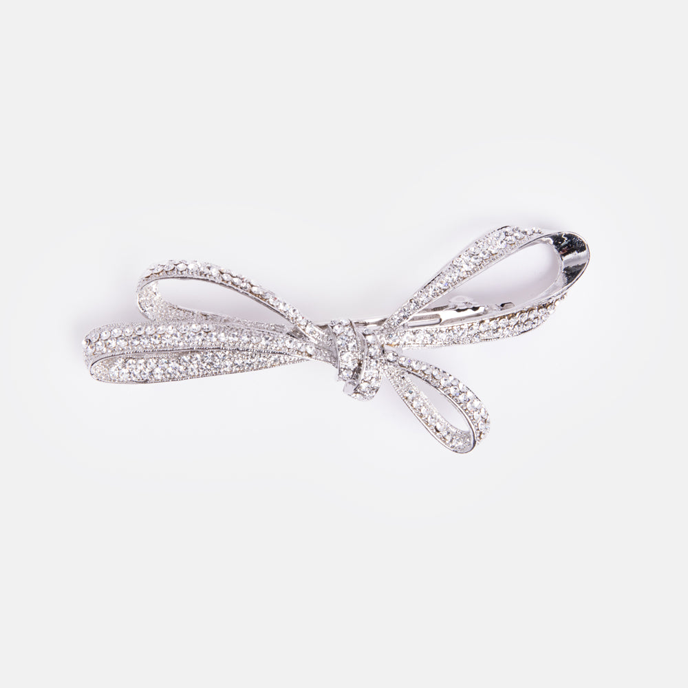 silver metal bow hairclip encrusted with small crystals