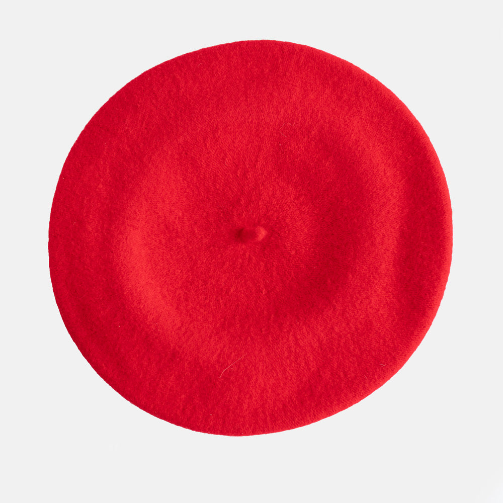 A bright red felt beret hat shown from a top-down view on a light gray background.