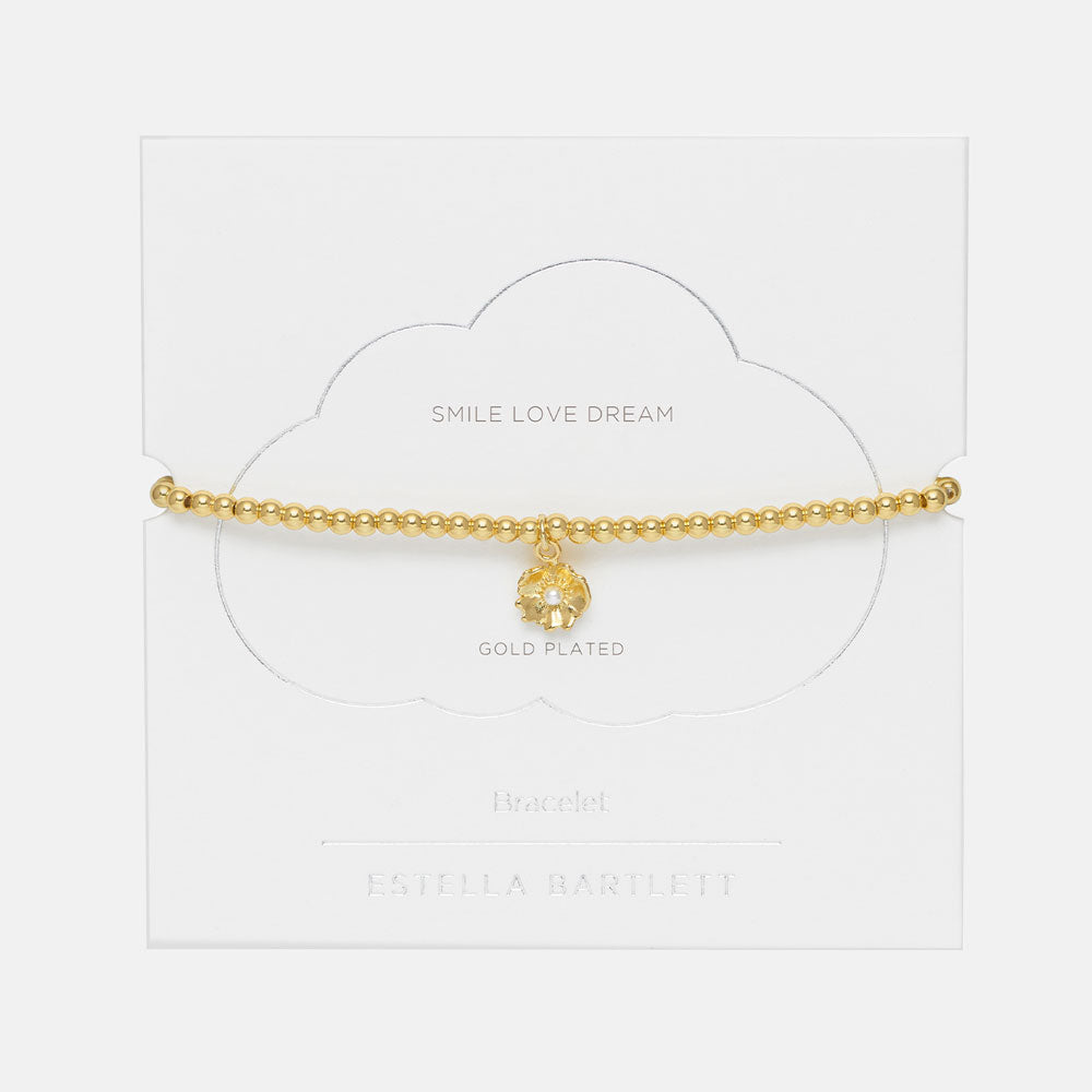 gold plated buttercup and pearl necklace in packaging