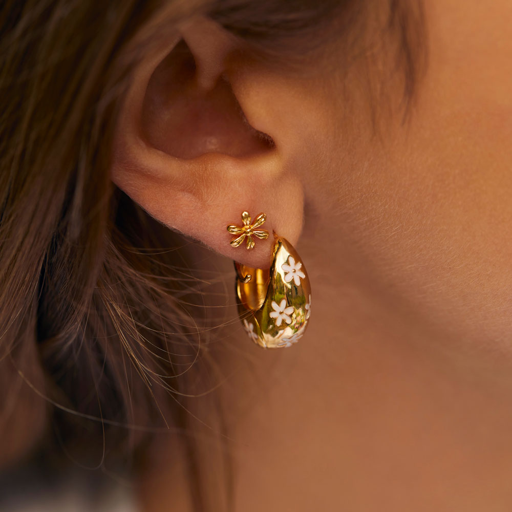 chunky gold plated daisy print hinge earrings worn with flower stud
