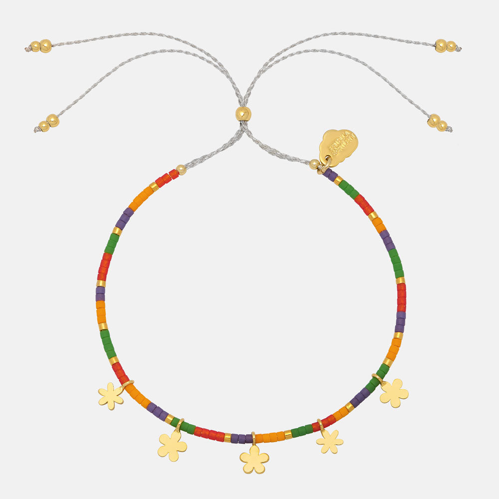 multi-coloured beaded bracelet with gold ditsy flower charms