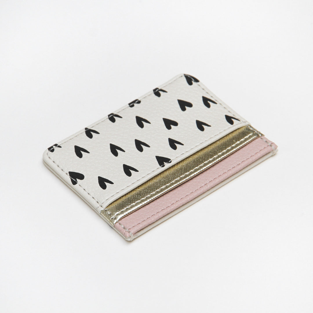 Travel card holder with scattered hearts and pockets